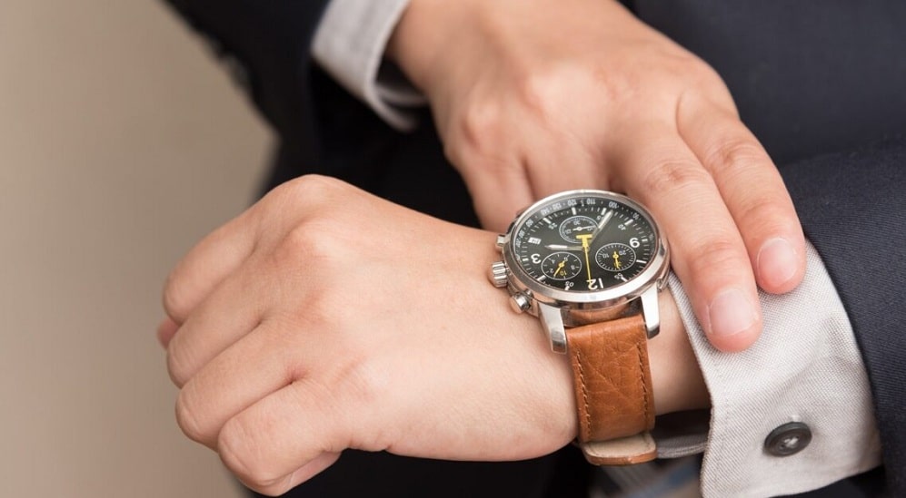 Businessman checking the time