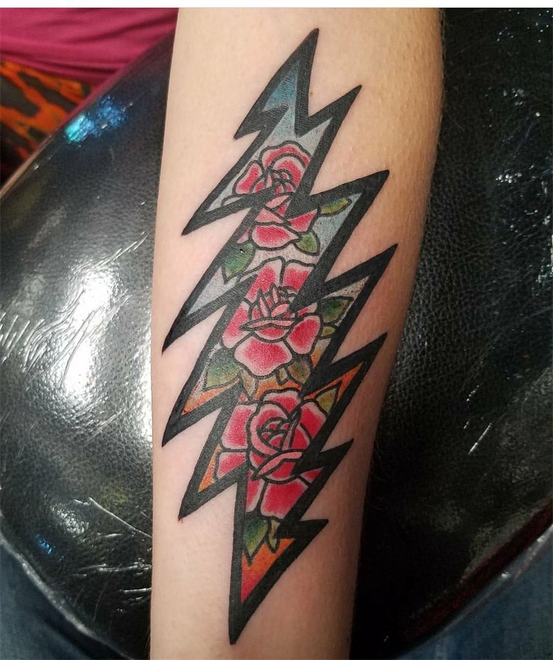 Lightning and flower tattoo